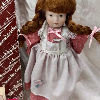 Sale Photo Thumbnail #232: Purple bohemian glass vase with small chip in rim, Resin camel 4 working music boxes, 1 Christmas snow globe.