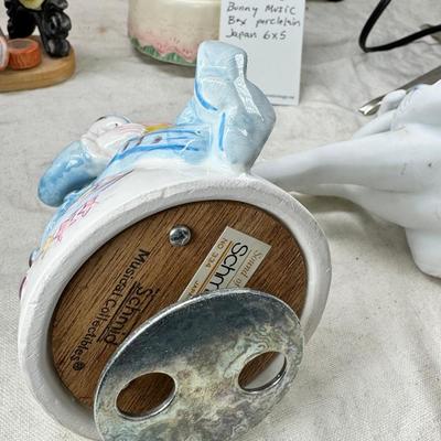 Sale Photo Thumbnail #225: Purple bohemian glass vase with small chip in rim, Resin camel 4 working music boxes, 1 Christmas snow globe.