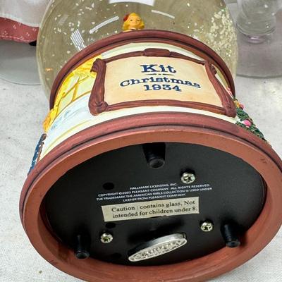 Sale Photo Thumbnail #231: Purple bohemian glass vase with small chip in rim, Resin camel 4 working music boxes, 1 Christmas snow globe.