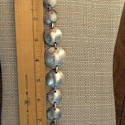 Pop out coin bracelet