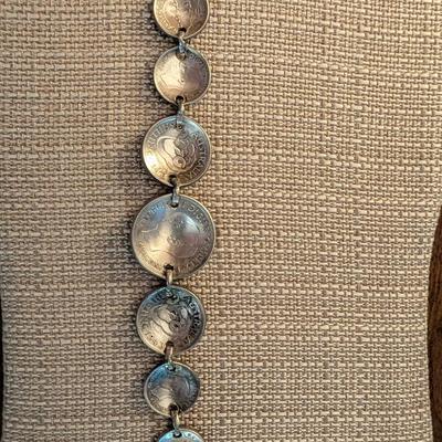 Pop out coin bracelet