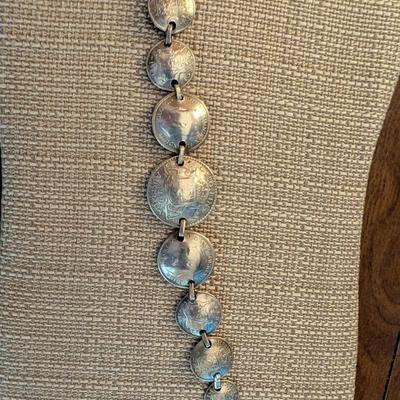 Pop out coin bracelet