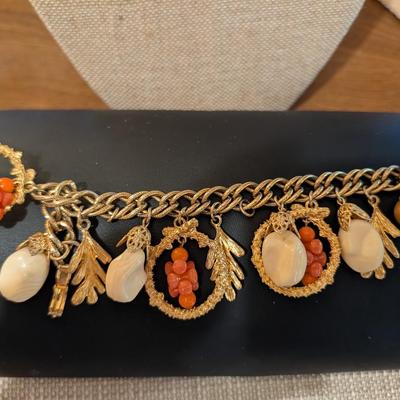 Chunky gold tone fall charm bracelet.