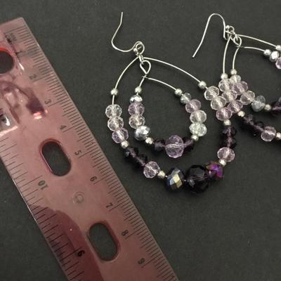 Beautiful facet of glass, light and dark purple statement earrings