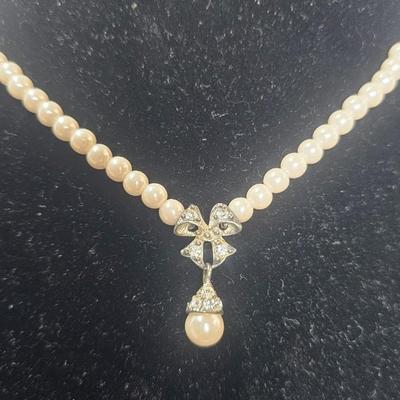 Vintage Faux Pearl Necklace with Rhinestone Bow Drop Pendant – Silver-Tone Clasp