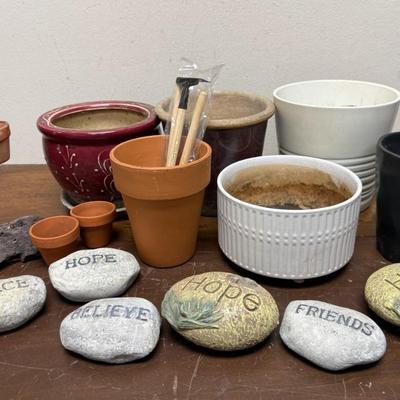 Sale Photo Thumbnail #532: Assorted ceramic and clay pots, river rocks with words like "friends", "hope", and "believe", and some small gardening tools. Good used condition.