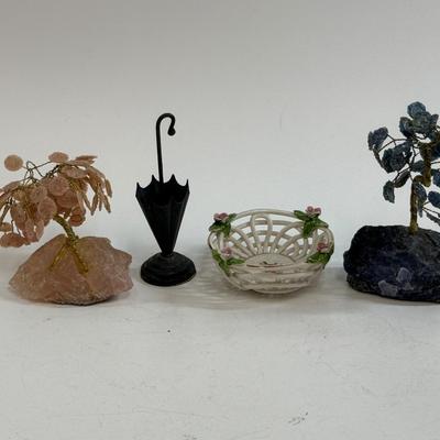 Sale Photo Thumbnail #546: This is a collection of miniature decorative objects, including two gemstone trees, a small ceramic basket, and a metal umbrella stand. All in good condition.