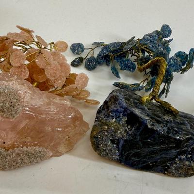 Sale Photo Thumbnail #539: This is a collection of miniature decorative objects, including two gemstone trees, a small ceramic basket, and a metal umbrella stand. All in good condition.