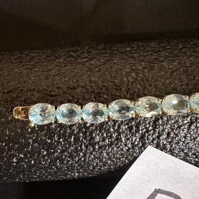.925 STERLING SILVER TENNIS BRACELET WITH LIGHT BLUE STONES
