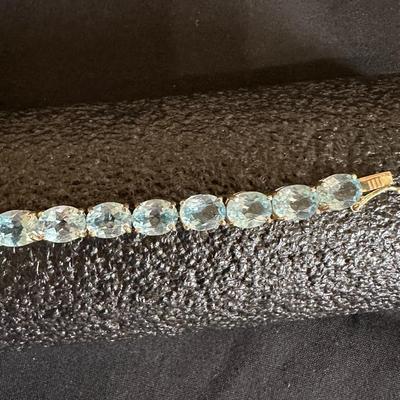 .925 STERLING SILVER TENNIS BRACELET WITH LIGHT BLUE STONES