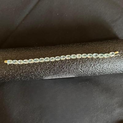 .925 STERLING SILVER TENNIS BRACELET WITH LIGHT BLUE STONES