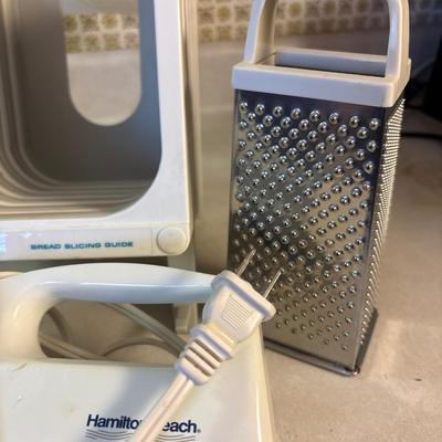 Hand mixer, electric knife, bread slicer, cookie press