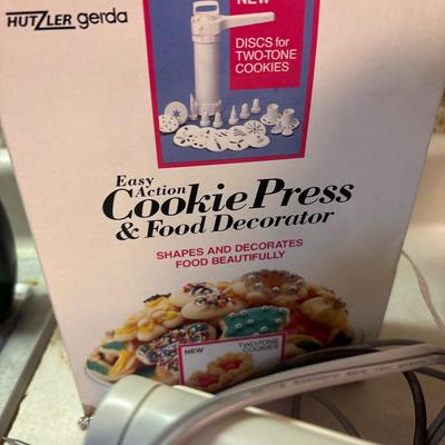 Hand mixer, electric knife, bread slicer, cookie press