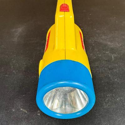 Sale Photo Thumbnail #557: Vintage Playskool color-changing toy flashlight, originally released around 1986. Has a knob to change the lens from red to clear to green. Untested, but appears to be in good working condition.