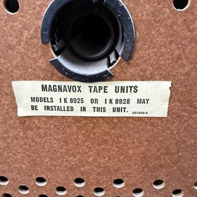 Sale Photo Thumbnail #584: From the early 1970's, pecan finish. Untested. Contains a record player and AM/FM Stereo Receiver Caster wheels underneath to make repositioning easy. Measures approx. 54" x 20" x 27" high. Speakers measure 16" x 11" x 23" high. Includes original paperwor