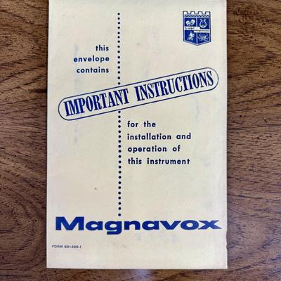Sale Photo Thumbnail #575: From the early 1970's, pecan finish. Untested. Contains a record player and AM/FM Stereo Receiver Caster wheels underneath to make repositioning easy. Measures approx. 54" x 20" x 27" high. Speakers measure 16" x 11" x 23" high. Includes original paperwor