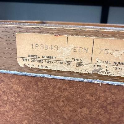 Sale Photo Thumbnail #581: From the early 1970's, pecan finish. Untested. Contains a record player and AM/FM Stereo Receiver Caster wheels underneath to make repositioning easy. Measures approx. 54" x 20" x 27" high. Speakers measure 16" x 11" x 23" high. Includes original paperwor