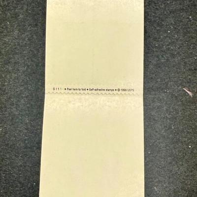 Sale Photo Thumbnail #592: This is a block of four 2001 34c Holiday Santas stamps, Scott #3537a-3540a. New condition.