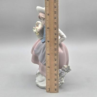 LOT 26L: Lladro Sweet Scent Girl and Mrs. Claus Figurines
