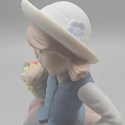 LOT 26L: Lladro Sweet Scent Girl and Mrs. Claus Figurines