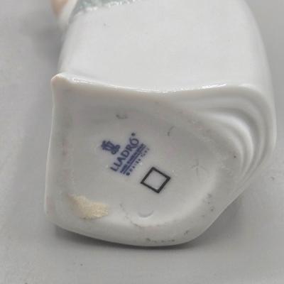 LOT 26L: Lladro Sweet Scent Girl and Mrs. Claus Figurines