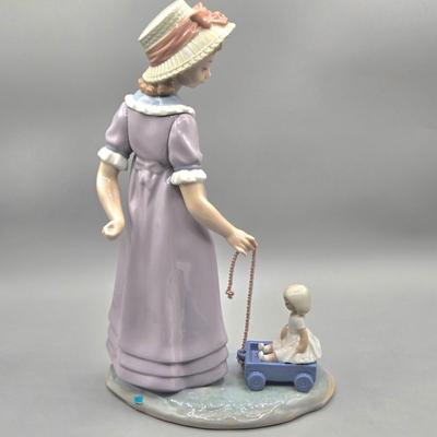 LOT 35L: Retired Lladró Pulling Dolls Carriage Porcelain Figurine