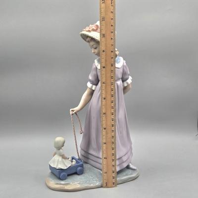 LOT 35L: Retired Lladró Pulling Dolls Carriage Porcelain Figurine