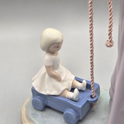 LOT 35L: Retired Lladró Pulling Dolls Carriage Porcelain Figurine