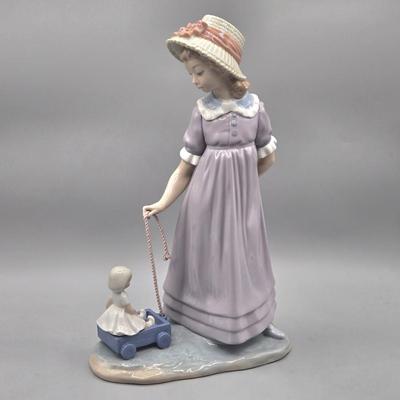 LOT 35L: Retired Lladró Pulling Dolls Carriage Porcelain Figurine