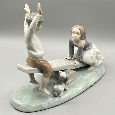LOT 47: Lladro Children Playing SeeSaw Figurine