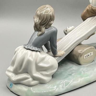 LOT 47: Lladro Children Playing SeeSaw Figurine