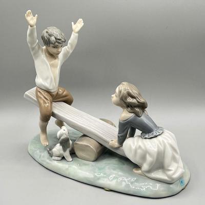 LOT 47: Lladro Children Playing SeeSaw Figurine