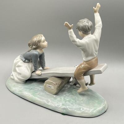 LOT 47: Lladro Children Playing SeeSaw Figurine