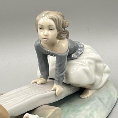 LOT 47: Lladro Children Playing SeeSaw Figurine
