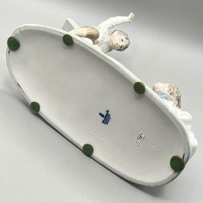 LOT 47: Lladro Children Playing SeeSaw Figurine