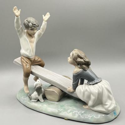 LOT 47: Lladro Children Playing SeeSaw Figurine