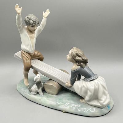 LOT 47: Lladro Children Playing SeeSaw Figurine