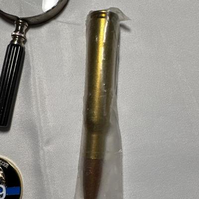 Commemorative Jason Moszer coins and patches, lighter, bullet, and more