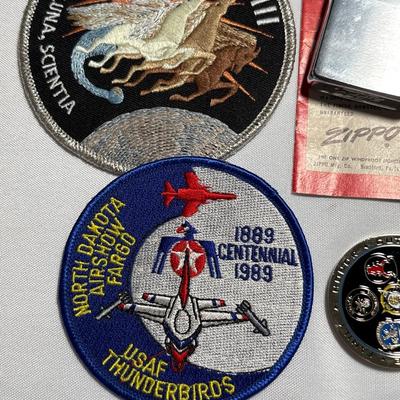 Commemorative Jason Moszer coins and patches, lighter, bullet, and more