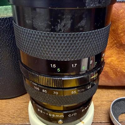 Sale Photo Thumbnail #609: From the late 70’s, includes custom fabric nick strap, matched Konica Autowinder, Konica 50mm lens with Asanuma 55mm Skylight 1A filter, Soligor 35-105mm zoom lens with Macro, Hoya 72mm Skylight 1B filter and case, extra filter and adapter ring, auto re