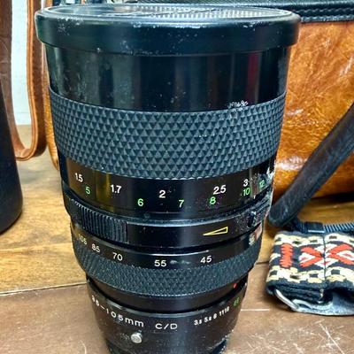 Sale Photo Thumbnail #613: From the late 70’s, includes custom fabric nick strap, matched Konica Autowinder, Konica 50mm lens with Asanuma 55mm Skylight 1A filter, Soligor 35-105mm zoom lens with Macro, Hoya 72mm Skylight 1B filter and case, extra filter and adapter ring, auto re