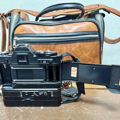 Sale Photo Thumbnail #620: From the late 70’s, includes custom fabric nick strap, matched Konica Autowinder, Konica 50mm lens with Asanuma 55mm Skylight 1A filter, Soligor 35-105mm zoom lens with Macro, Hoya 72mm Skylight 1B filter and case, extra filter and adapter ring, auto re