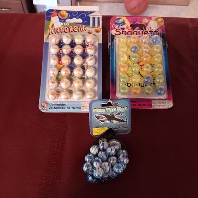 UNOPENED PACKAGES OF MARBLES