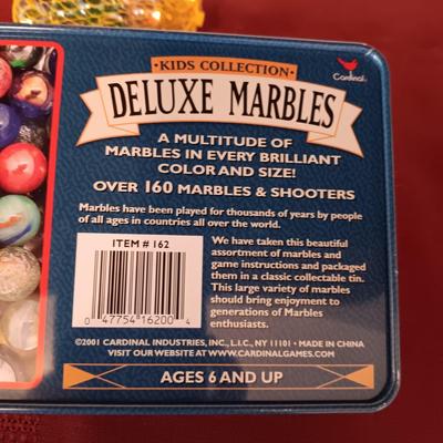UNOPENED PACKAGES OF MARBLES