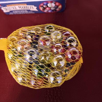 UNOPENED PACKAGES OF MARBLES