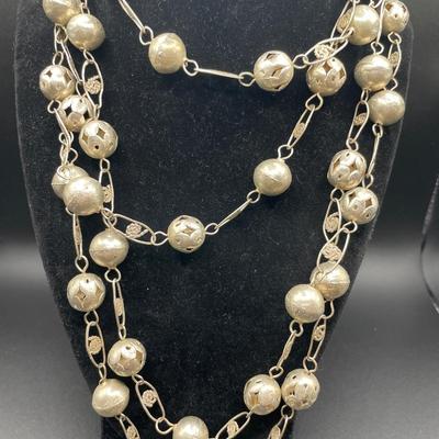 Very unique silver tone necklaces