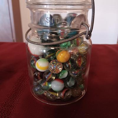 2 PINT SIZE JARS OF MARBLES