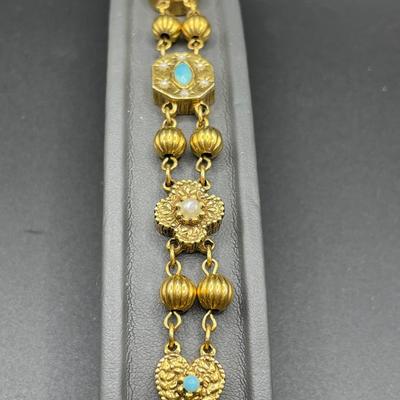 Similar gold tone bracelets