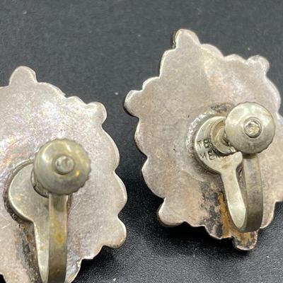 Silver tone bracelets and Mexican screwback earrings