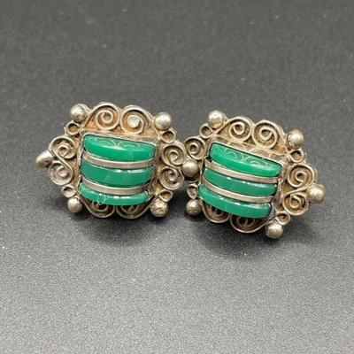 Silver tone bracelets and Mexican screwback earrings